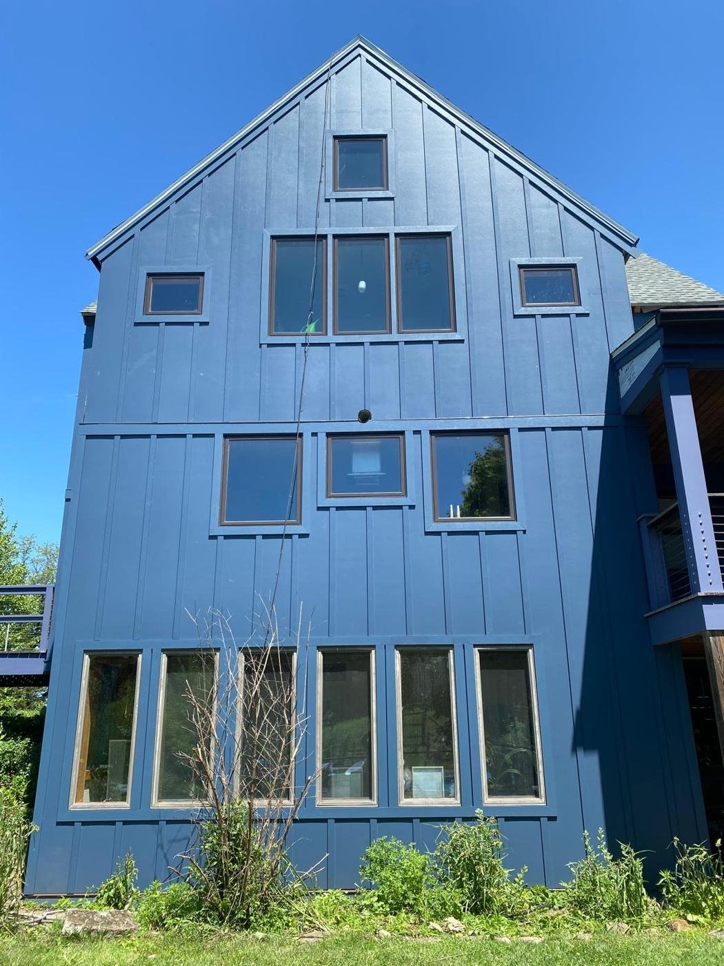 Blue board-and-batten siding on a Dutchess County home
