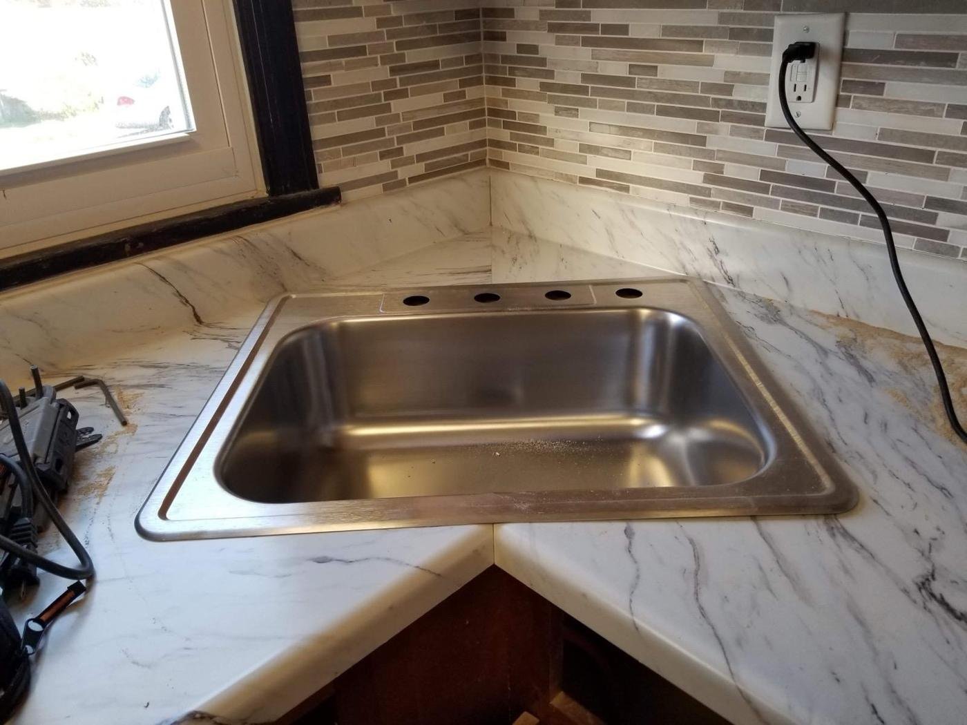 Kitchen countertop and mosaic tile backsplash